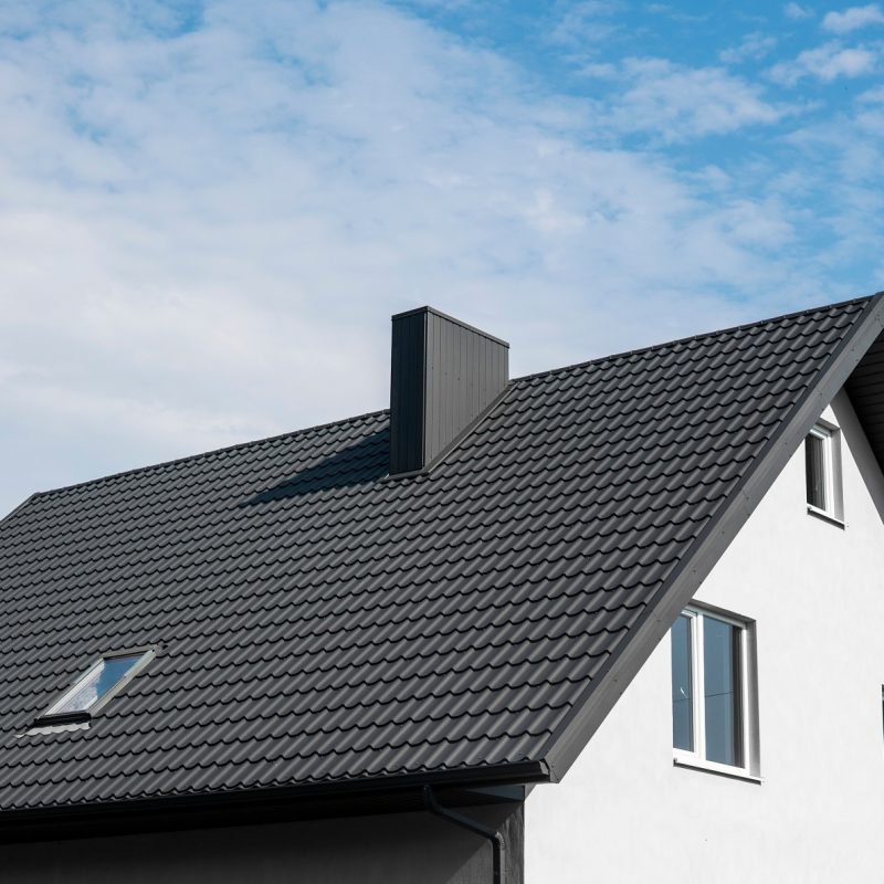 Modern roof covered with tile effect PVC coated brown metal roof sheets
